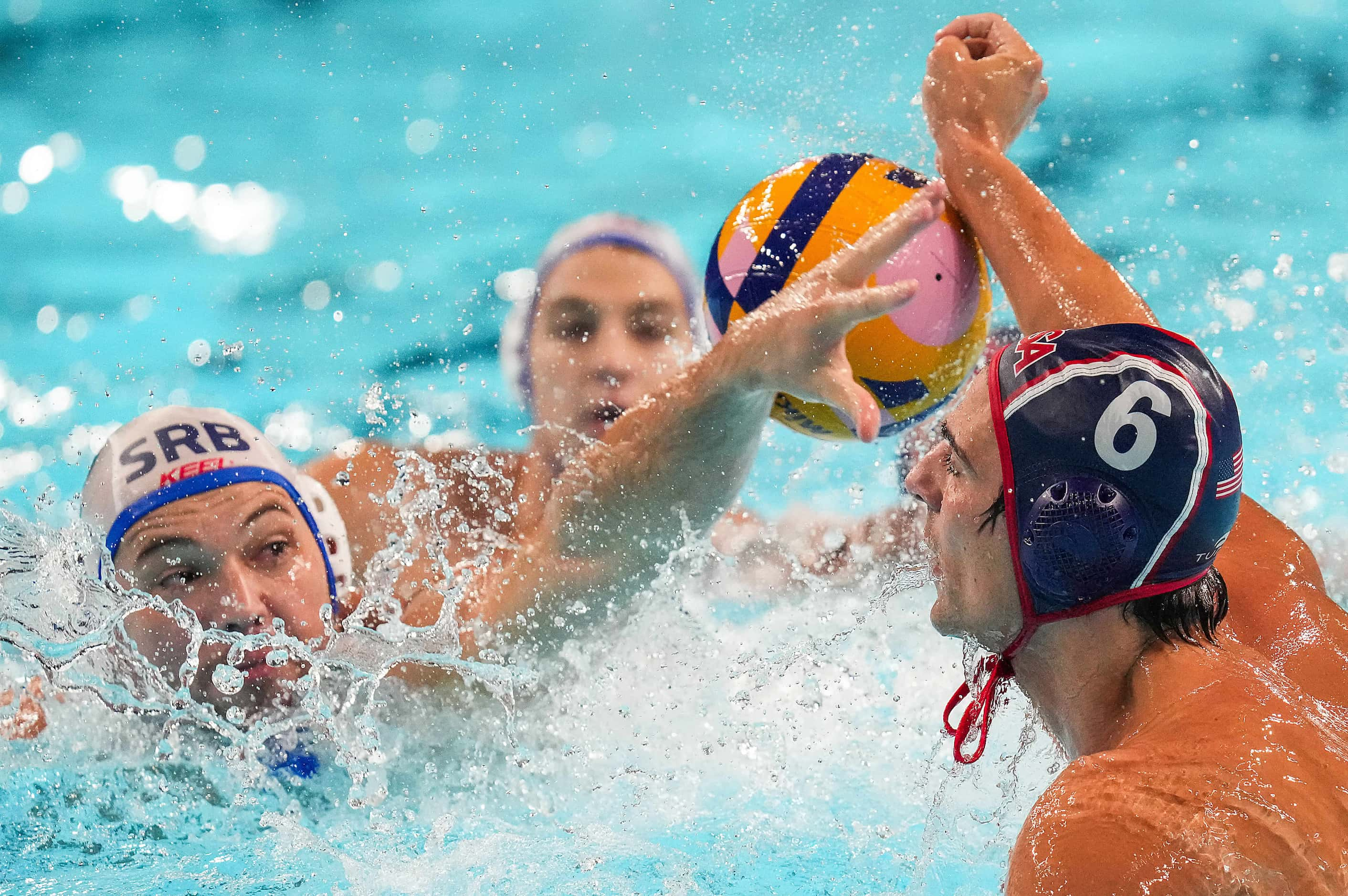 Dusan Mandic (2) of Serbia knocks the ball away from Luca Cupido (6) of the United States...