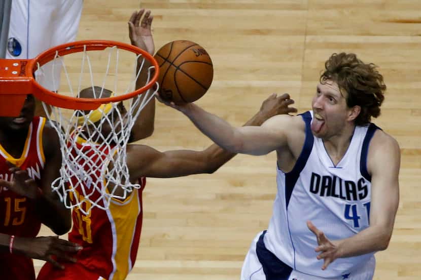 Dallas Mavericks forward Dirk Nowitzki drives for the net in the first quarter during game 4...