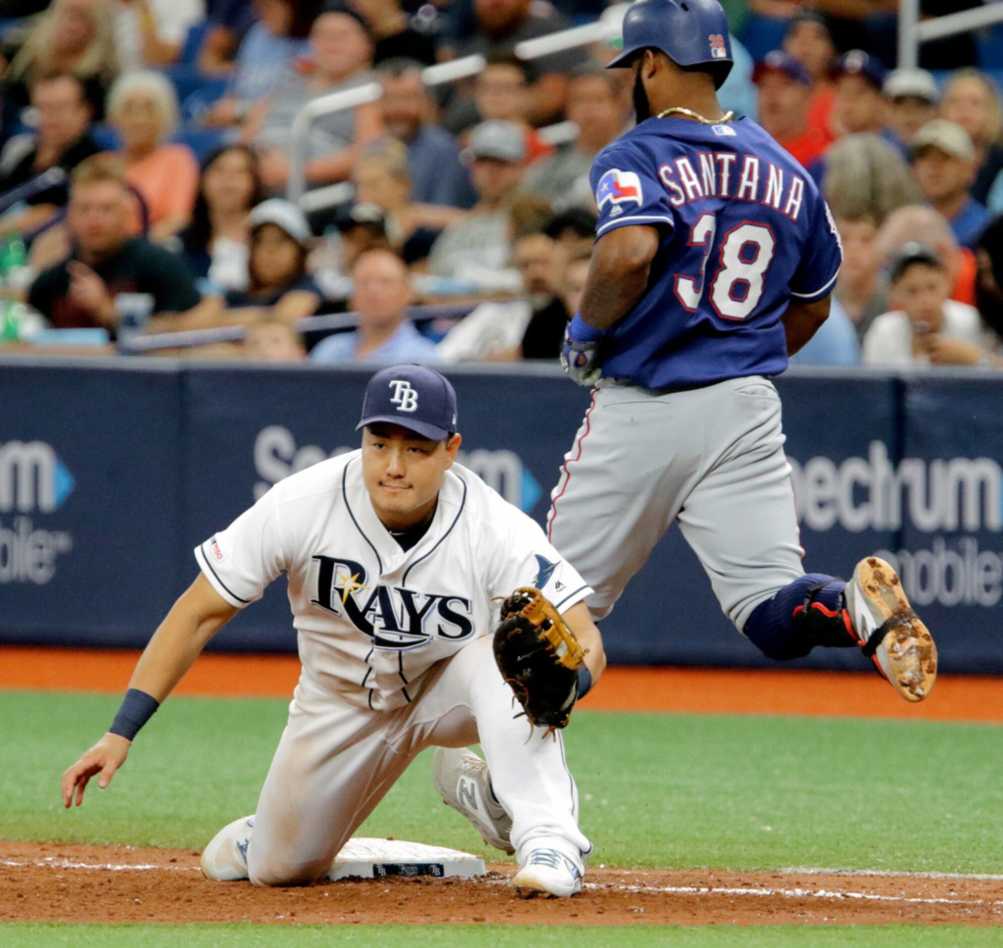 ST. PETERSBURG, FL - JUNE 29: Ji-Man Choi #26 of the Tampa Bay Rays catches the ball on a...