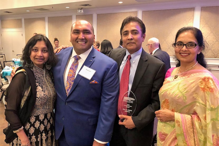 From left, Sejal Desai and Hussain Manjee with Immigrant Journey Award winners Raj Asava and...