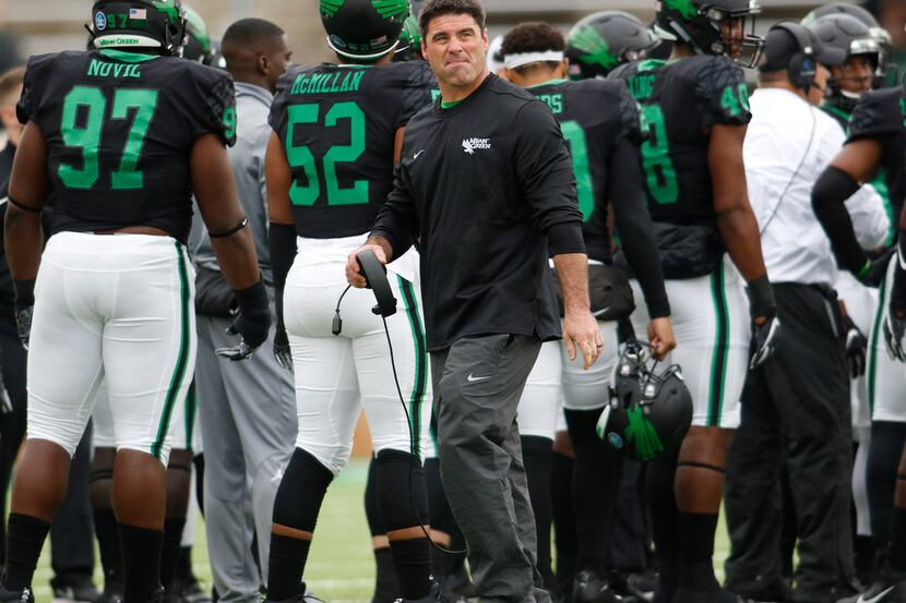 North Texas head coach Seth Littrell glances toward the scoreboard during a timeout during...