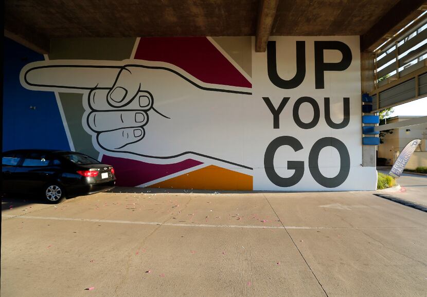 A large mural by artist Kyle Steed directs drivers into Fort Worth's WestBend development...