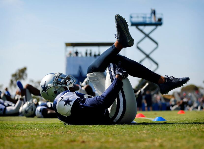 Dallas Cowboys strong safety Barry Church (42) stretches during afternoon practice at...