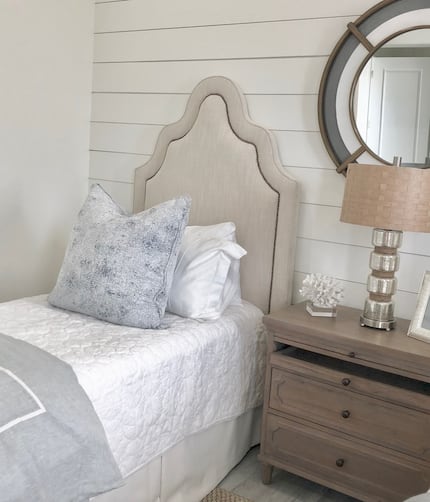 Natural fabrics and fibers create a tranquil and casual feel in this beach house guest room...