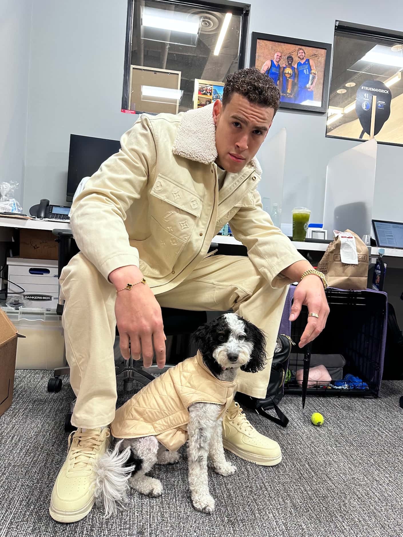 Mavericks player Dwight Powell with the team's emotional support dog, Bailey.