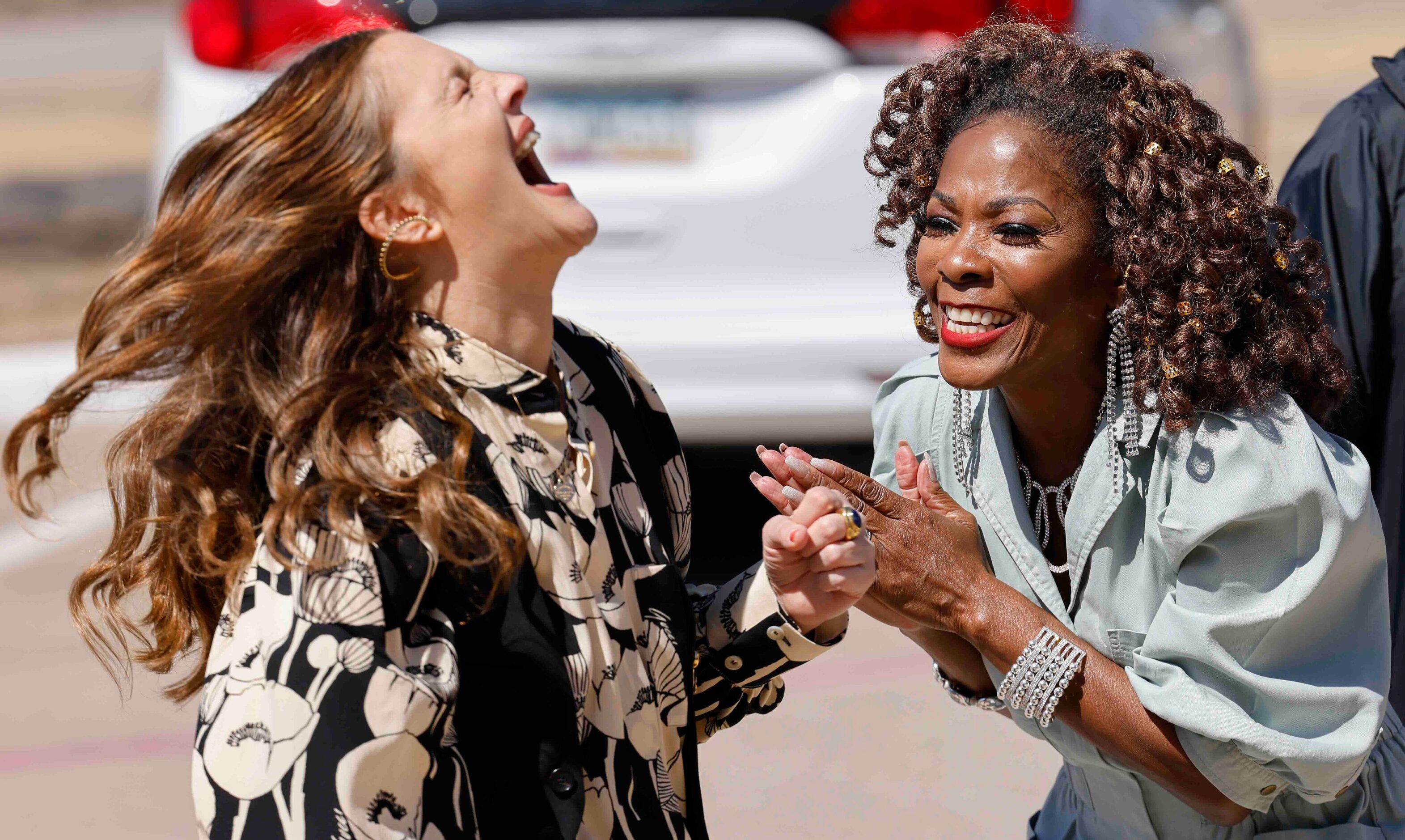 Drew Barrymore reacts while talking to Patricia Byrd right, during the recording of an...