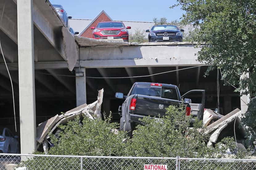 The scene at the parking garage collapse in Irving, the day after the destruction,...