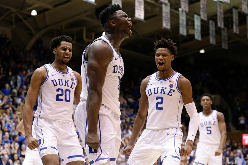 Duke's Zion Williamson, center, reacts with Marques Bolden (20), Cam Reddish (2) and RJ...