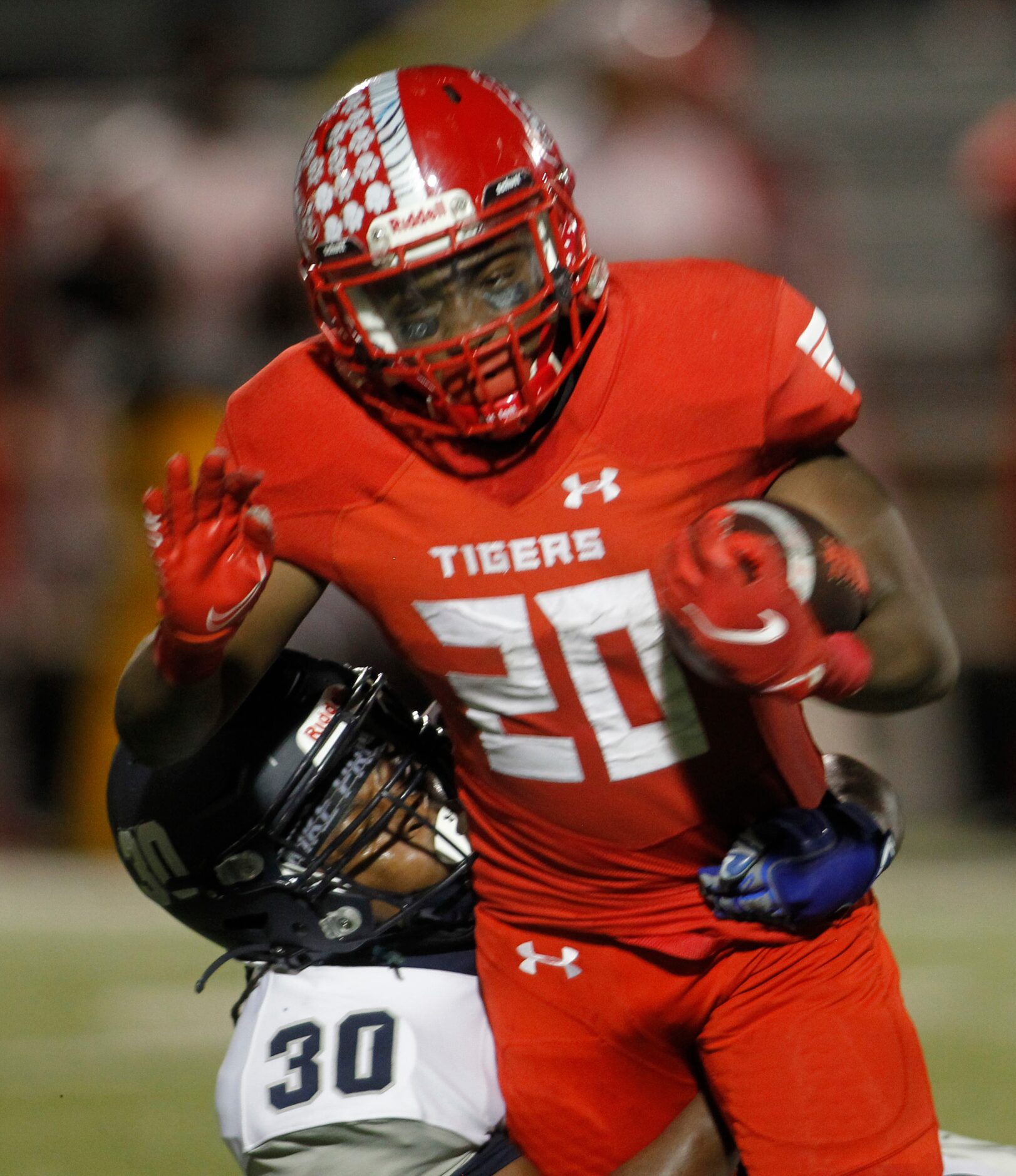 Terrell running back Chase Bingmon (20) rushes for a first down before being tackled by...