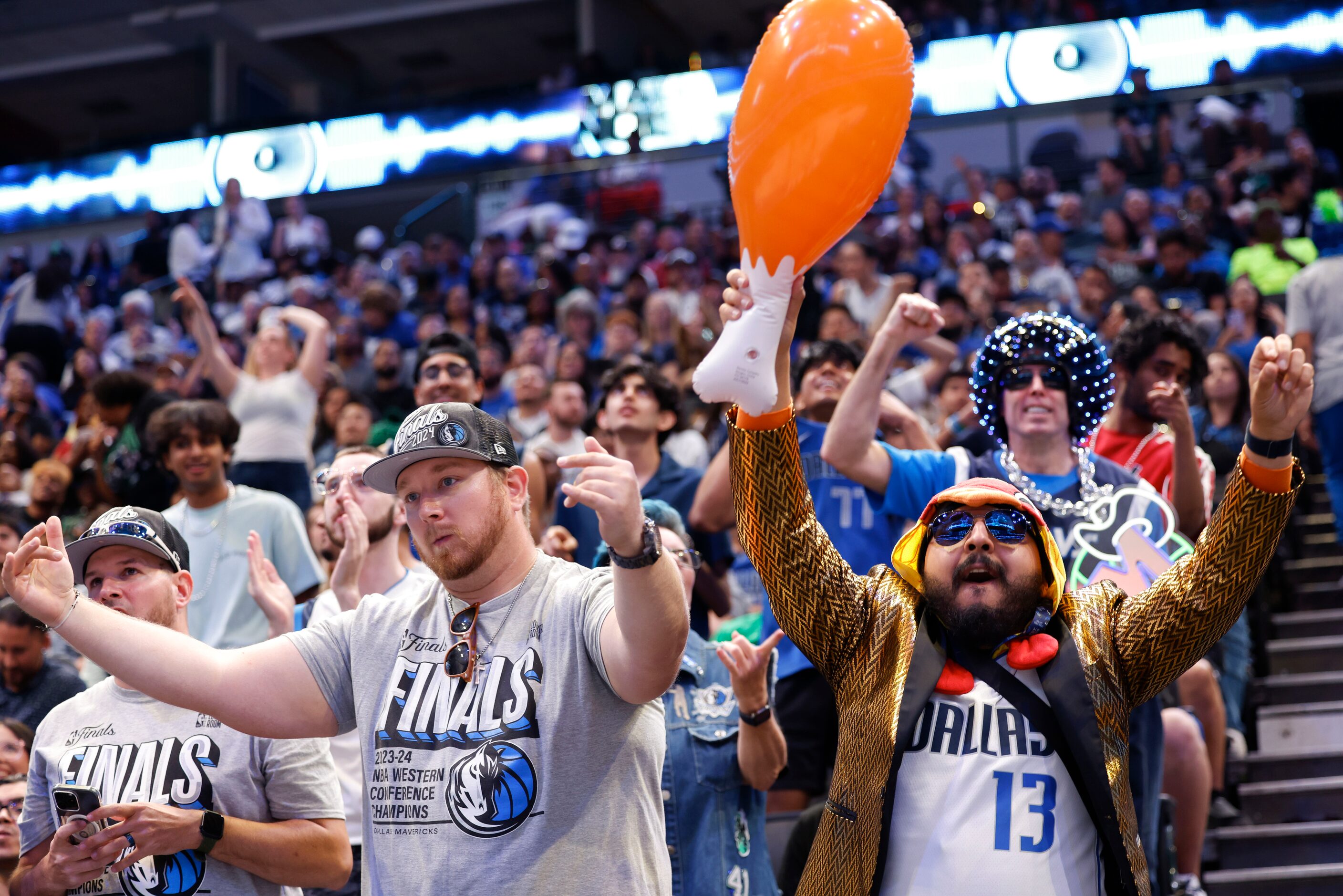 Jason Hicks (left) and Rudy Nunez cheer following a point during a watch party of Game 1 of...