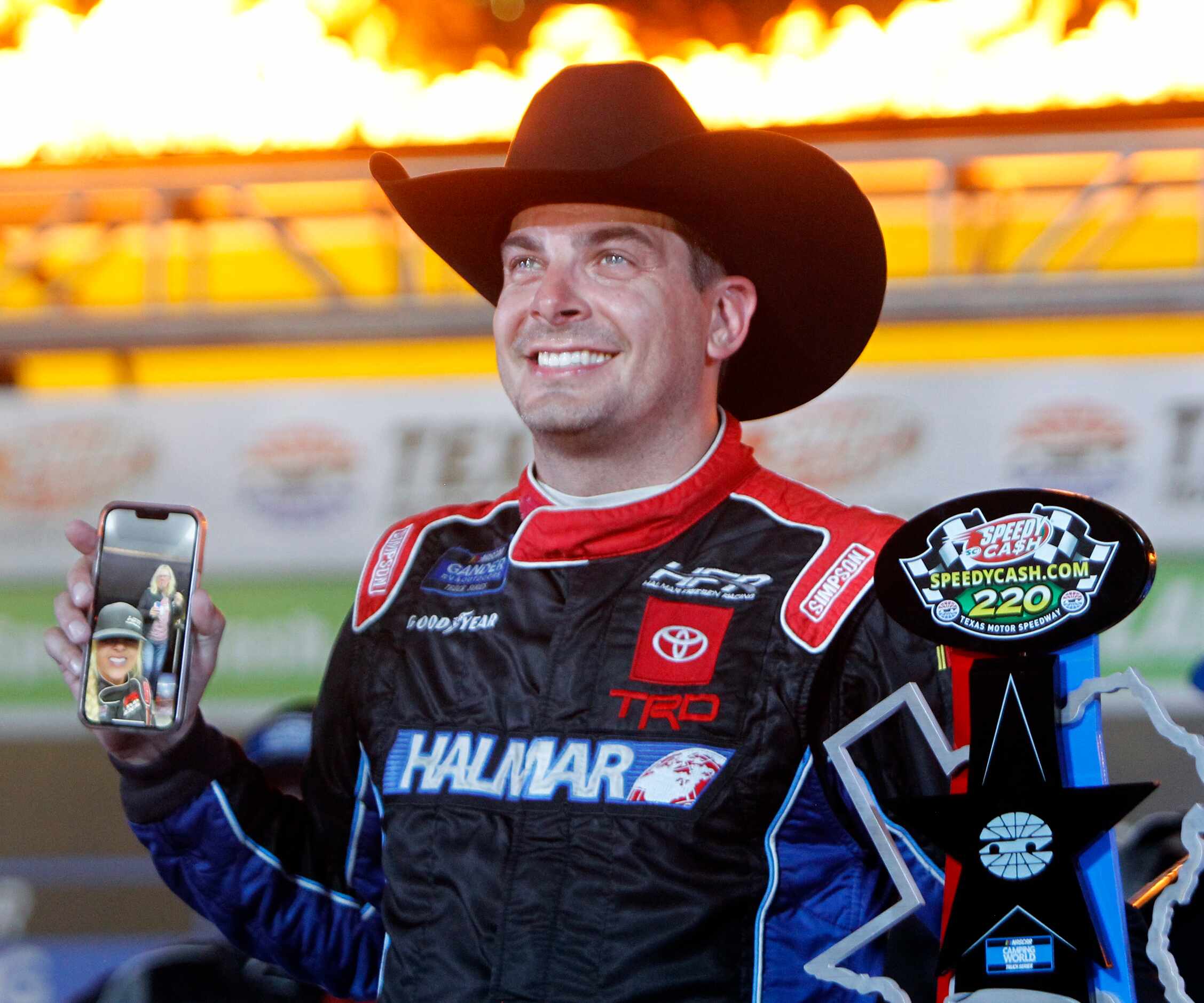 Through the magic of technology, Stewart Friesen is able to share a celebratory moment with...