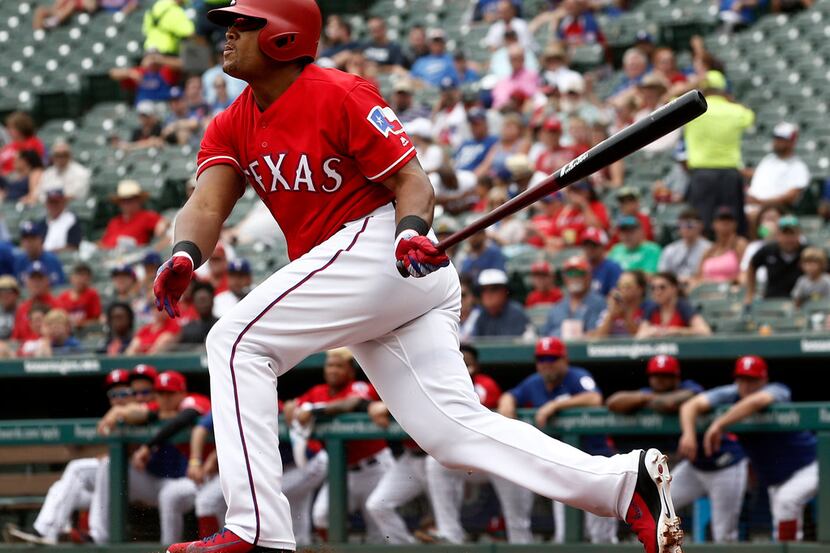 Texas Rangers Adrian Beltre bats against the Seattle Mariners during the first inning of a...