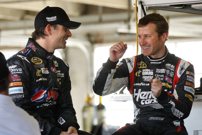 Sprint Cup Series drivers Jeff Gordon, left, and  Kasey Kahne discuss their NASCAR Sprint...