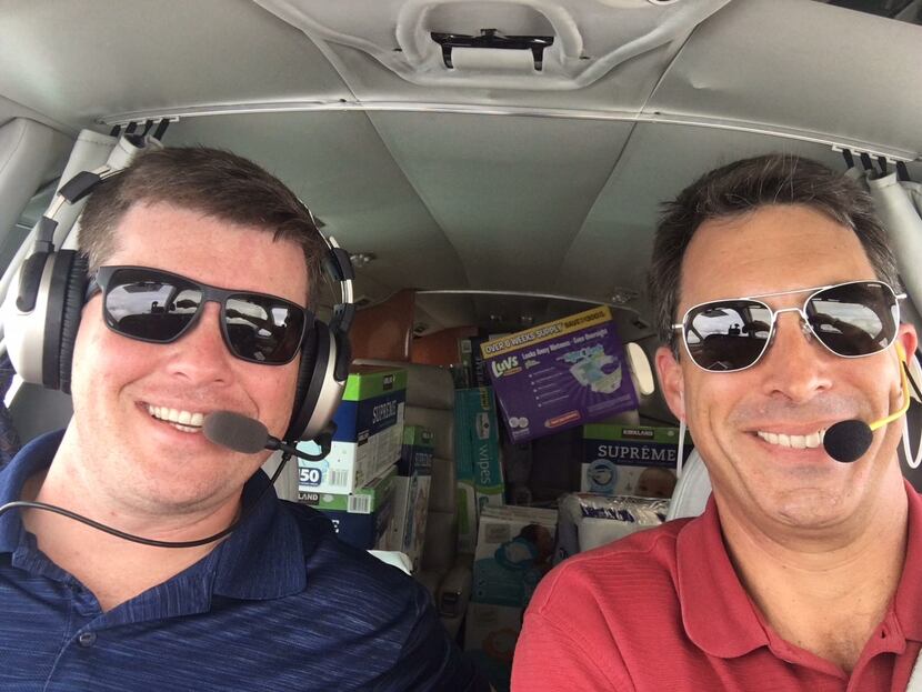 Brian Kelly (left) and Robert Johnson (right) delivering supplies for Operation Airdrop. 