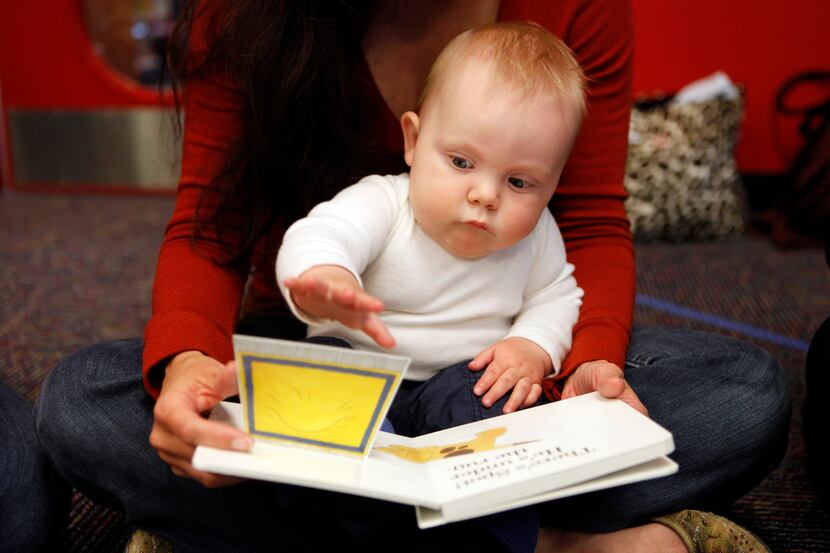 Laurie Willis and her son, Cort, 9 months, participate in a Babies & Books program, which...