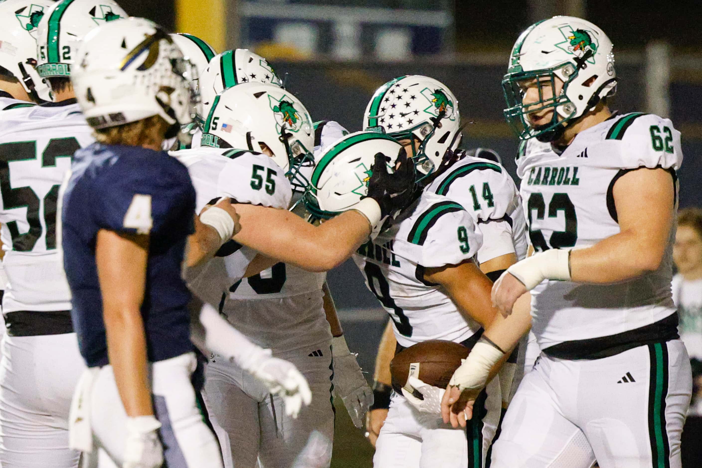 Southlake Carroll running back Riley Wormley (9) celebrates his touchdown with teammates...