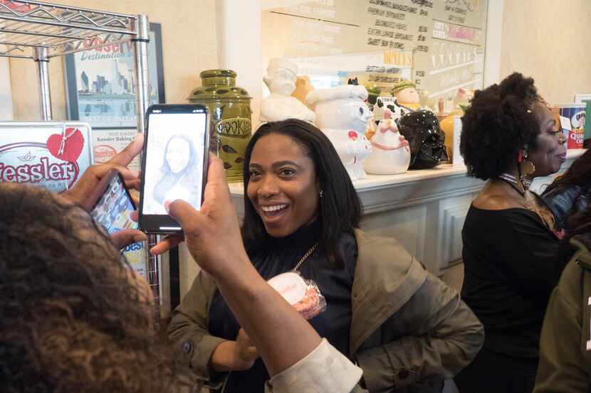 Attendees of the Soul of Dallas bus tour pose for pictures at Kessler Baking Studio in...