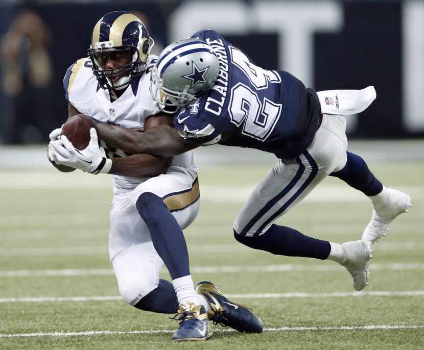 Dallas Cowboys cornerback Morris Claiborne (24) attempts to strip the ball from St. Louis...