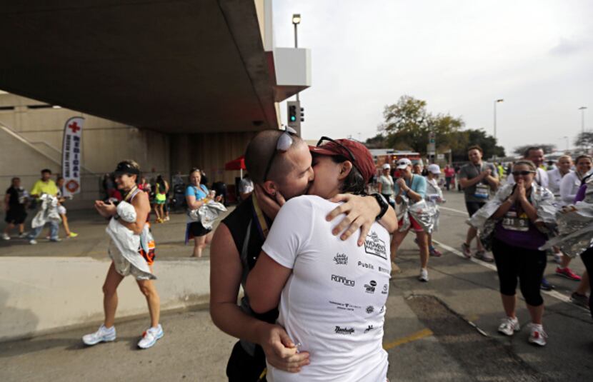 Josh Lewis (left) and girlfriend Jacqueline Vickery kiss after Lewis proposed during the...