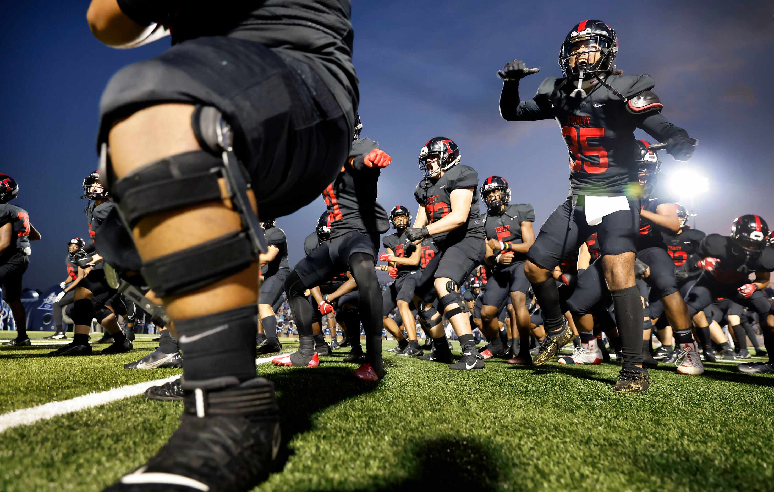 Euless Trinity football players, including Jarvis Heimuli (15), perform the Haka before...