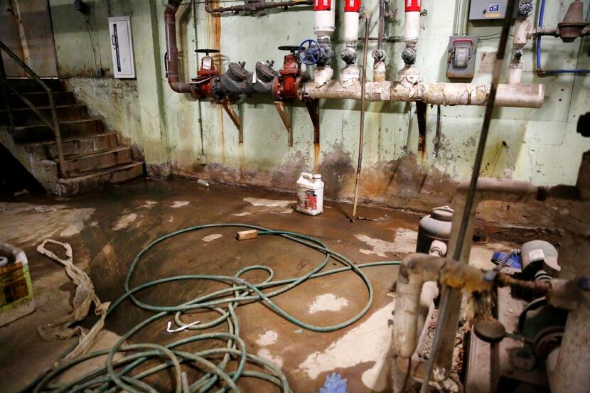 
Water leaks onto the floor of the boiler room at Edison Middle Learning Center, one of many...