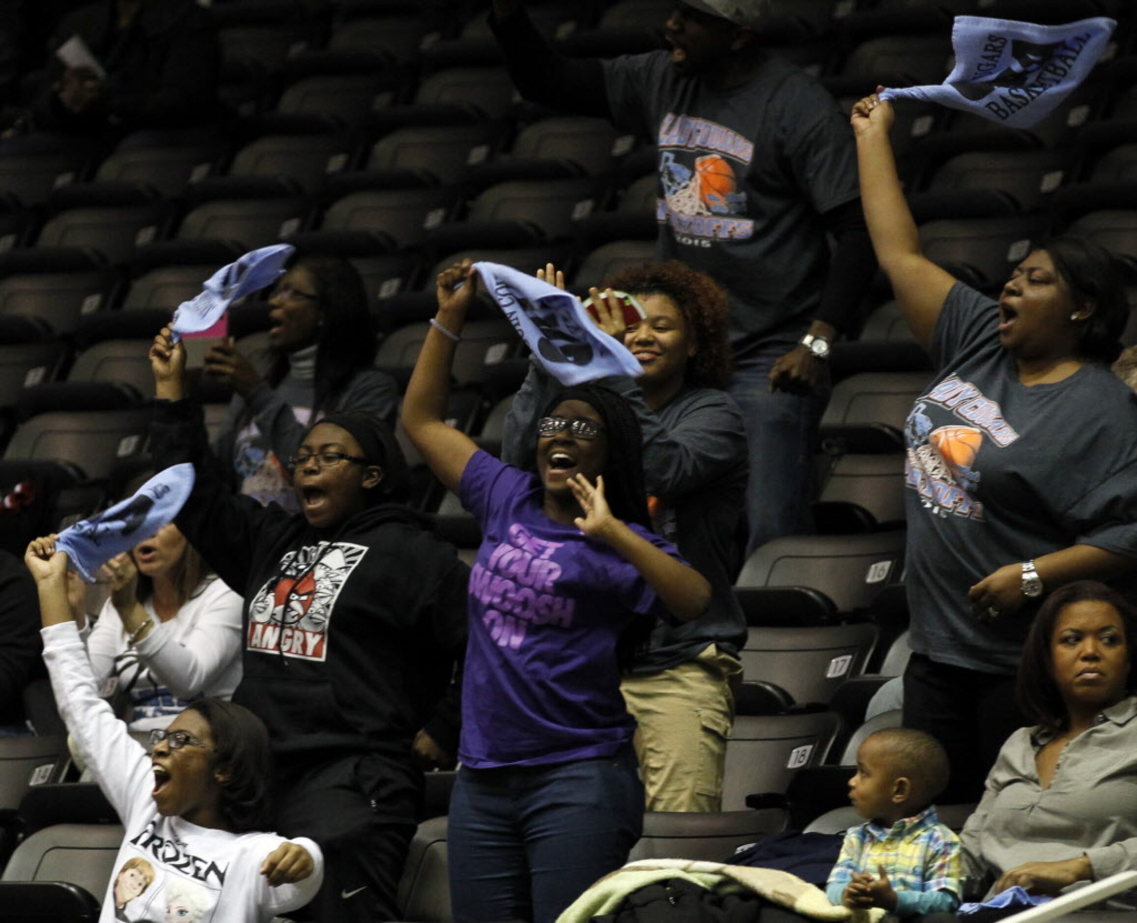 Arlington Seguin's react after making a basket during the Class 5A Region II girls...