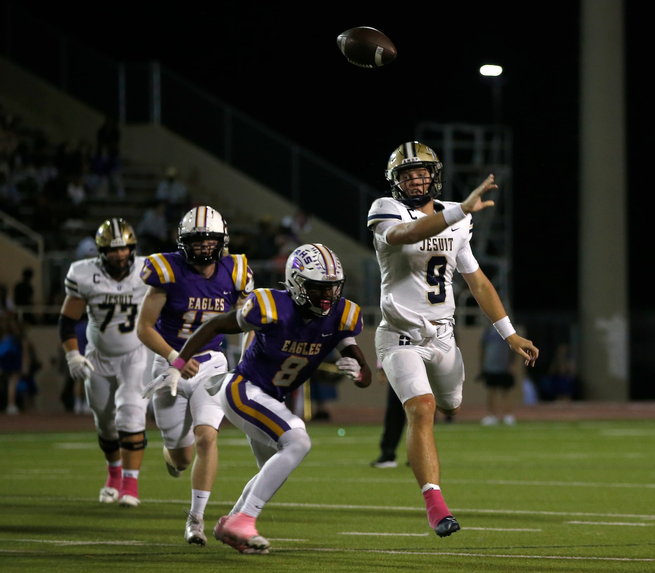 Jesuit quarterback Charlie Peters (9) passes the ball after crossing the line of scrimmage...