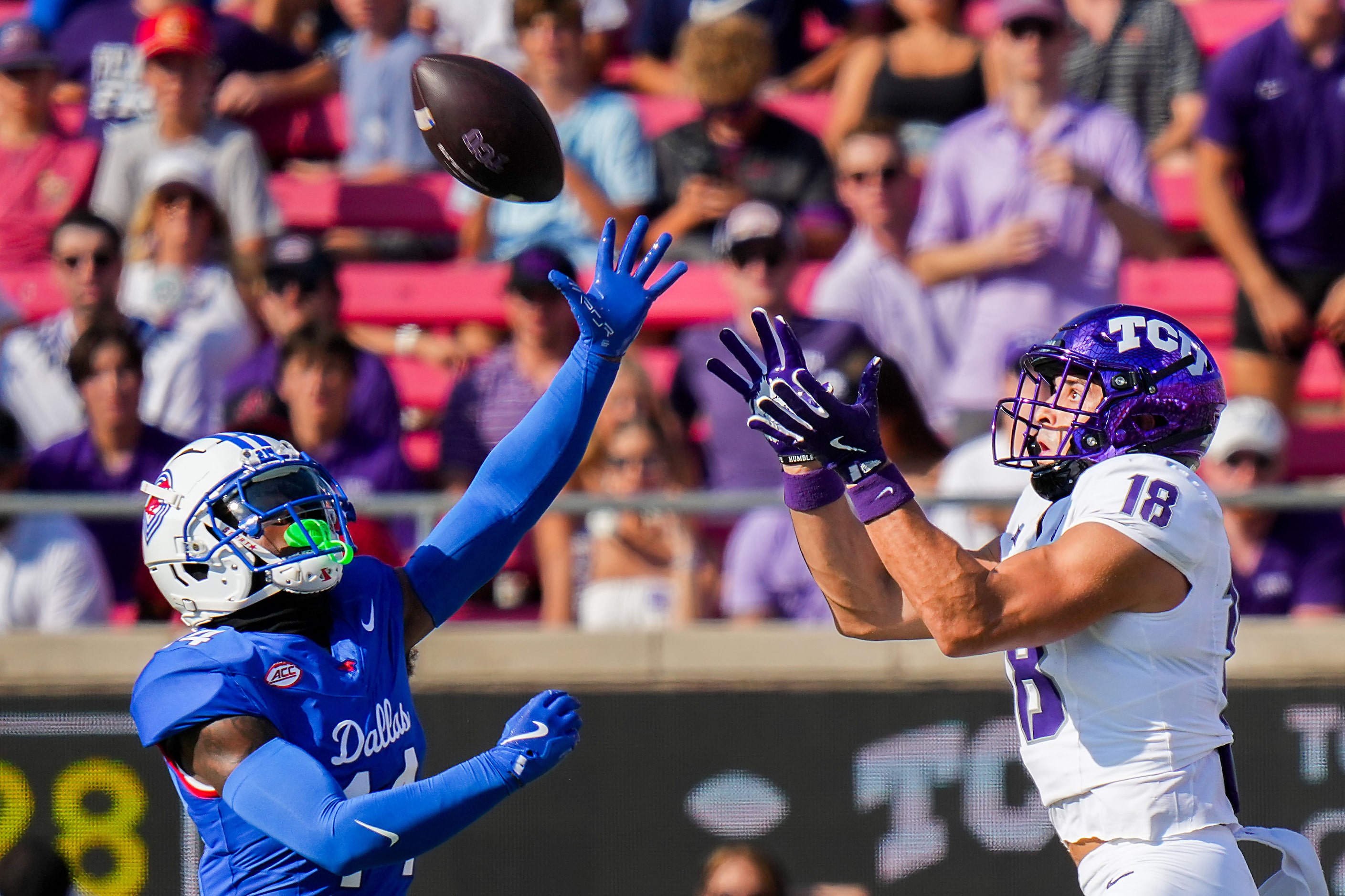 SMU cornerback AJ Davis (14) breaks up a pas intended for TCU wide receiver Jack Bech (18)...