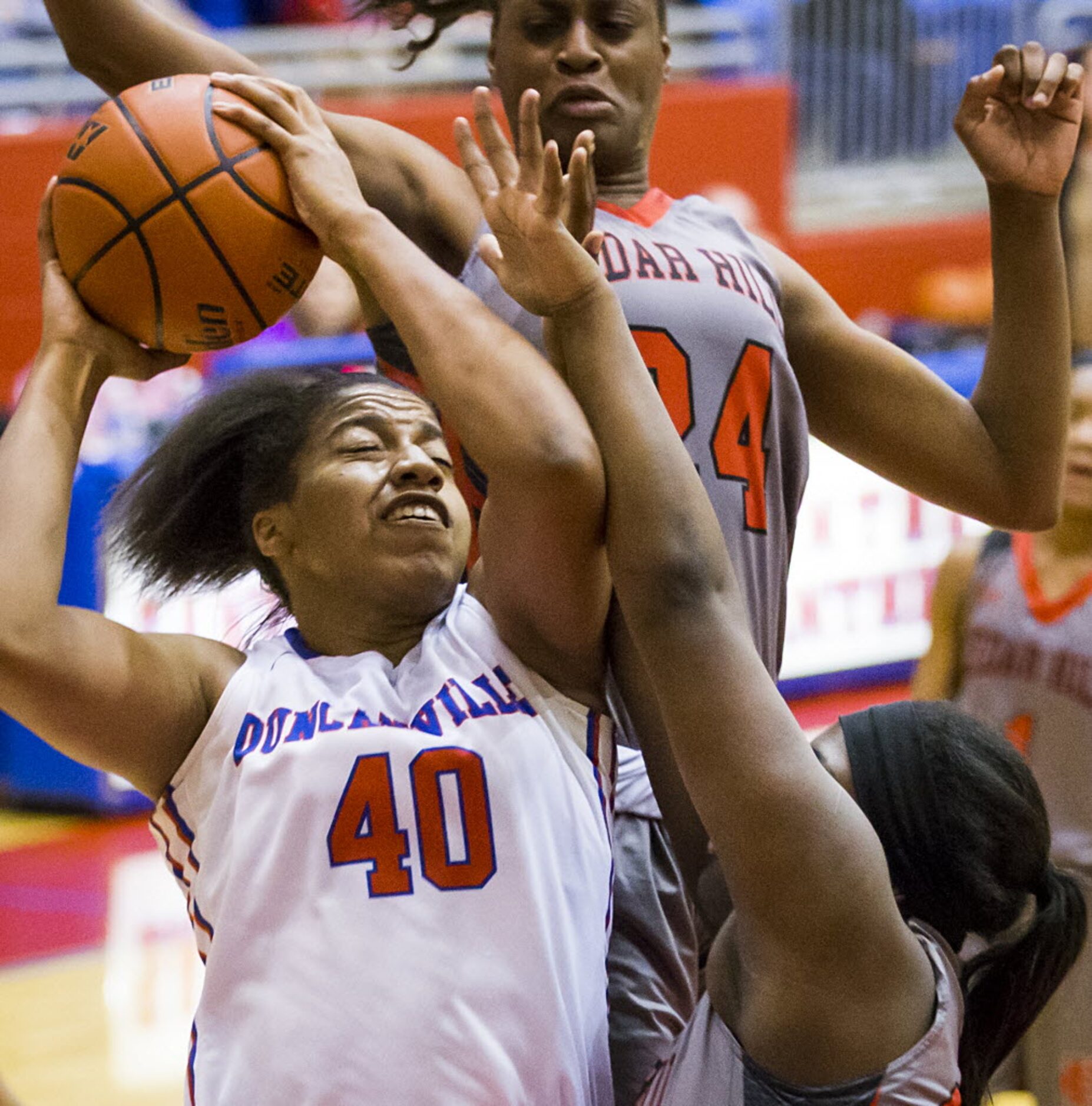 Duncanville forward Ciera Johnson (40) drives to the basket against Cedar Hill's Joyner...