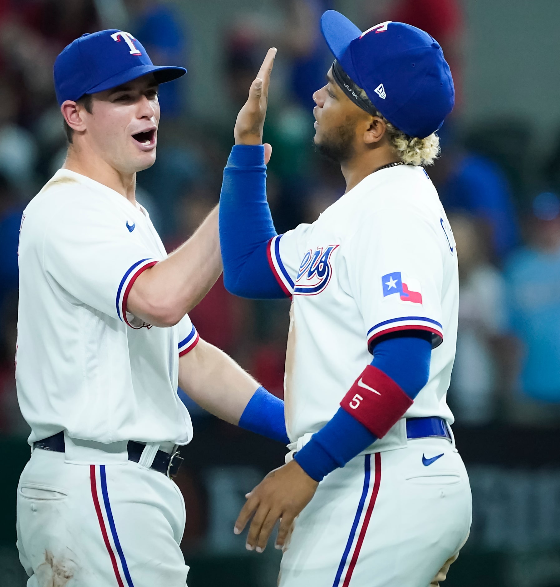 Texas Rangers second baseman Nick Solak (left) celebrates with designated hitter Willie...