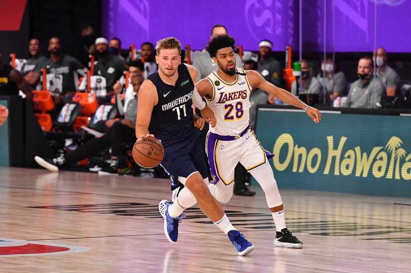 Luka Doncic #77 of the Dallas Mavericks drives to the basket against the Los Angeles Lakers...