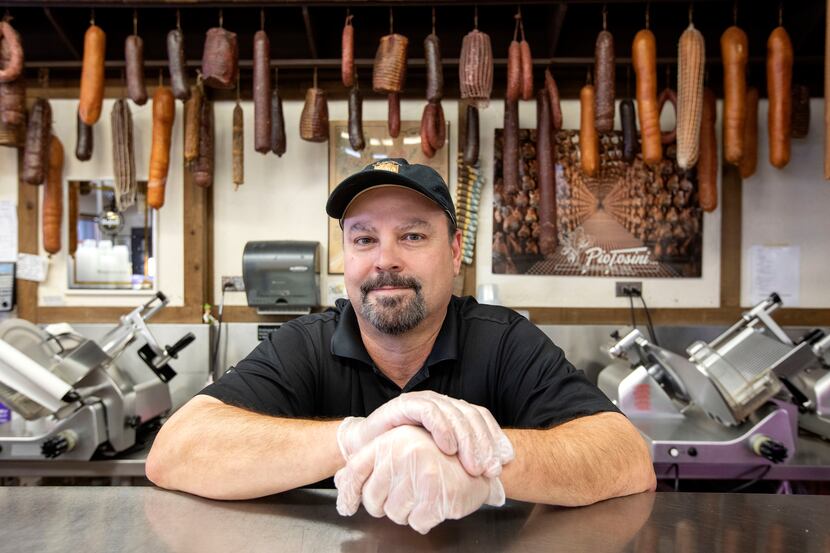 Karl Kuby Jr., owner of Kuby's Sausage House and European Market, poses for a portrait...