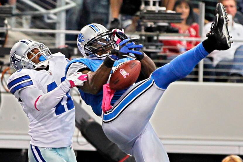 Detroit Lions wide receiver Calvin Johnson (81) comes up with a game-winning catch over...