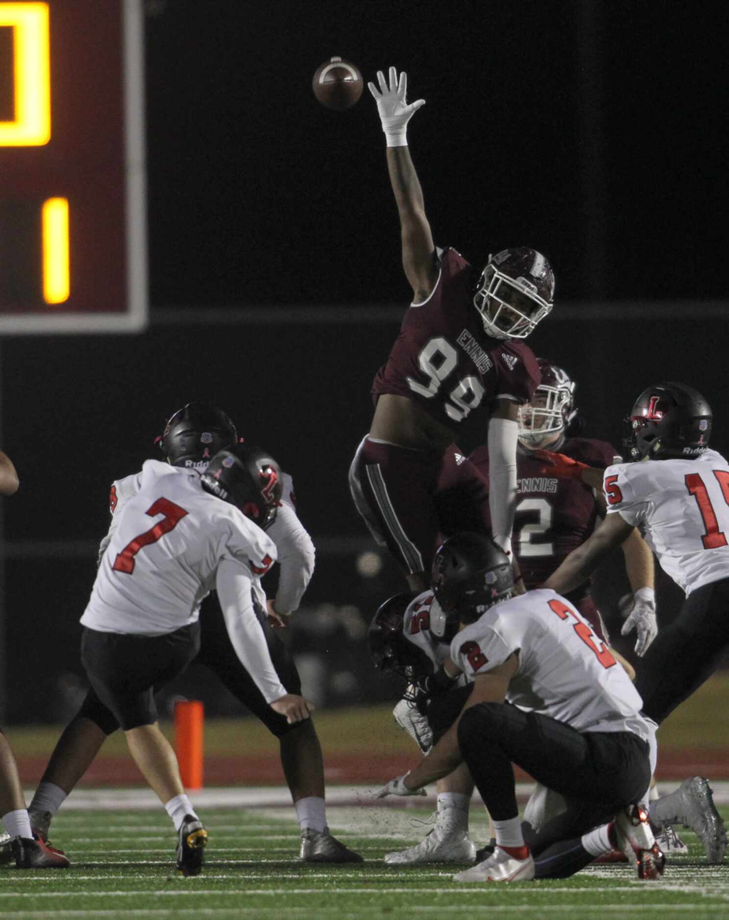Ennis defensive lineman Deryous Stokes (99) leaps in an attempt to block a field goal...
