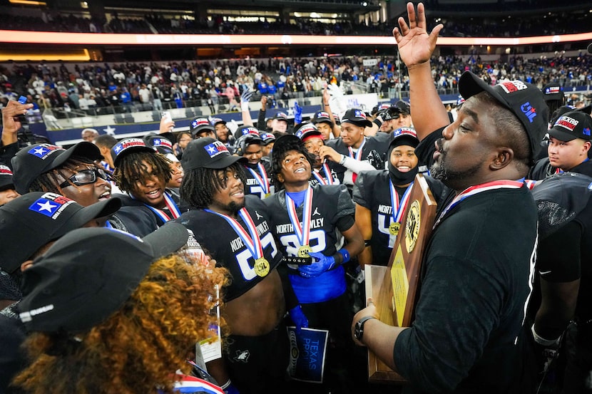 North Crowley head coach Ray Gates addresses his players after a victory over Austin...