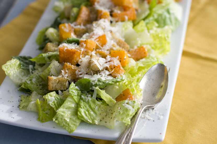 In this Jan. 24, 2012 photo, a plate of butternut Caesar salad with Romaine lettuce and...