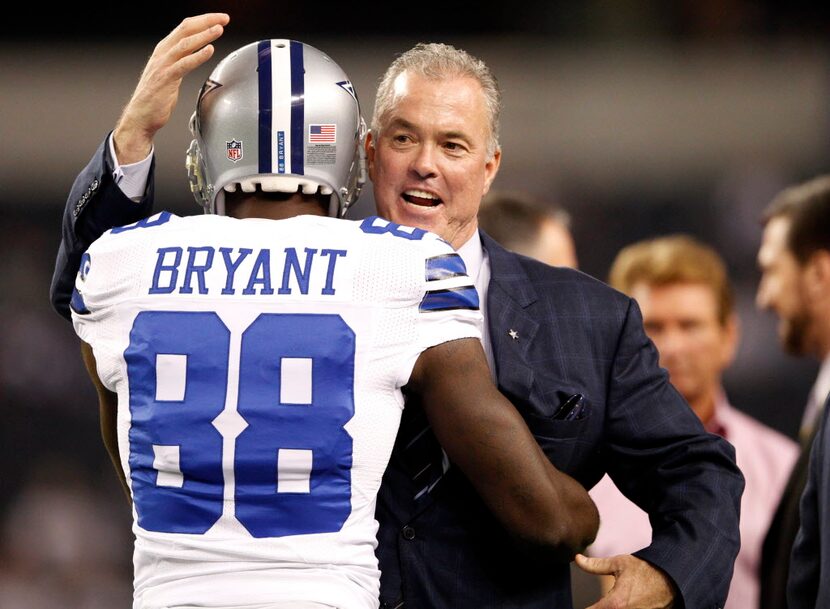 Dallas Cowboys executive vice president Stephen Jones hugs Dallas Cowboys wide receiver Dez...