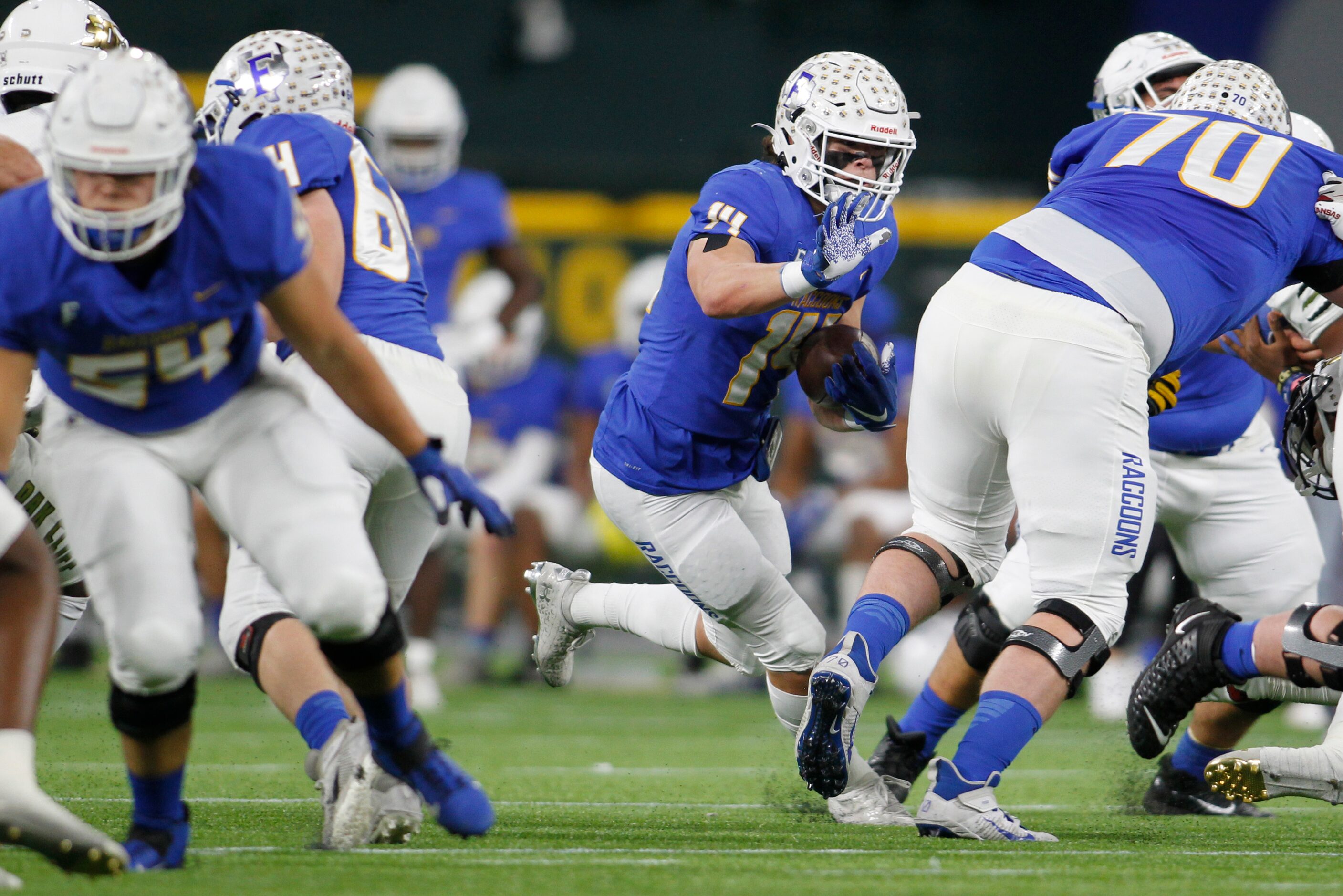 Frisco's Brandon Miyazono (14) follows his blocks during a first quarter rush in their game...