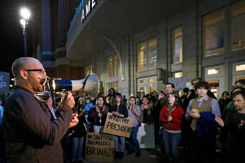 Daniel Cates uses a bullhorn to project his message during the Next Generation Action...