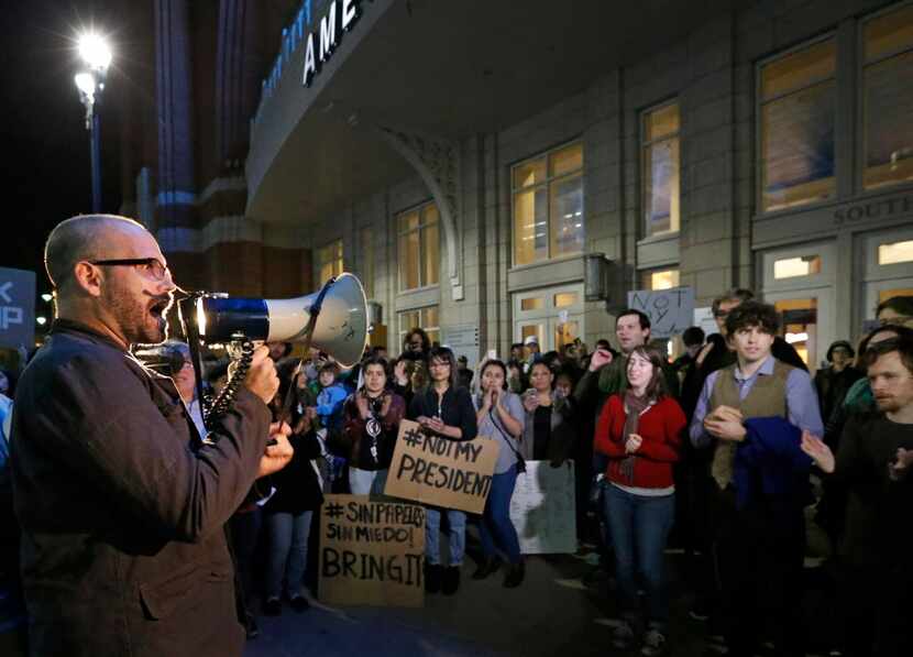 Daniel Cates uses a bullhorn to project his message during the Next Generation Action...