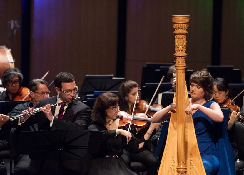 Flutist David Buck (left) and harpist Emily Levin perform Mozart's Concerto in C major for...