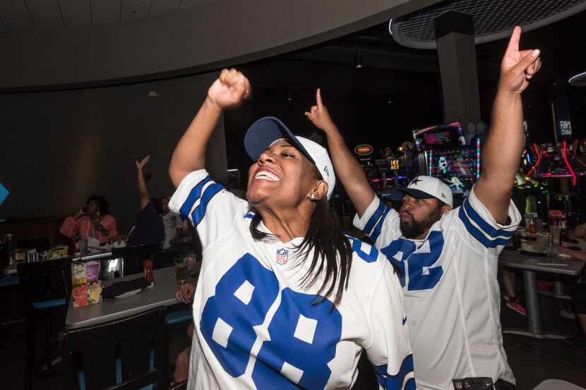 Donna Cotton and her husband, Brad Cotton, celebrated a Dallas Cowboys touchdown as they ...