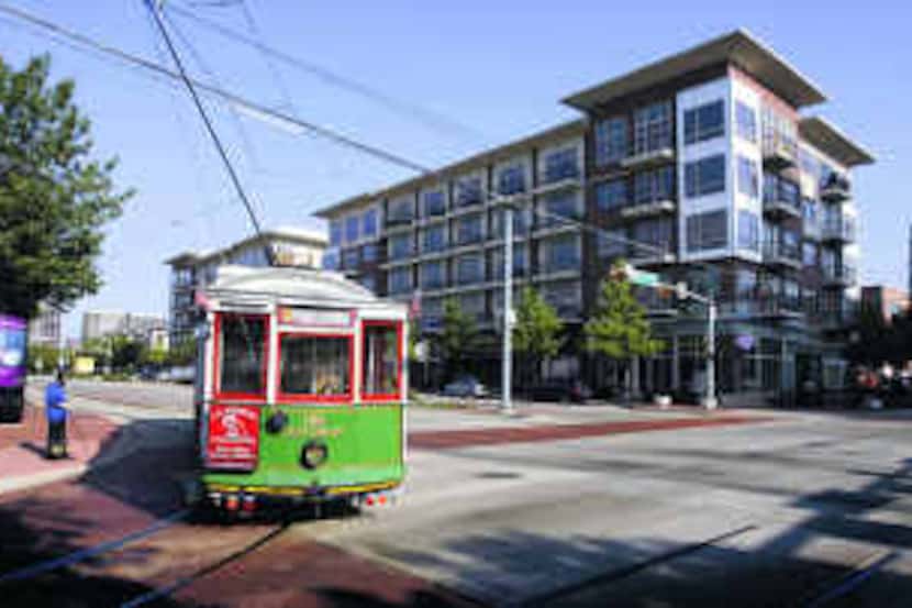  The M-line trolley turned by the Gables West Village apartments in the Cityplace area. In...