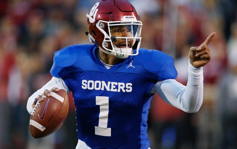 FILE - In this Friday, April 12, 2019 file photo, Oklahoma quarterback Jalen Hurts gestures...