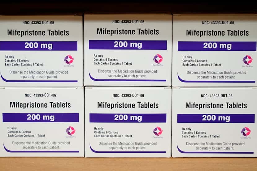 FILE - Boxes of the drug mifepristone sit on a shelf at the West Alabama Women's Center in...