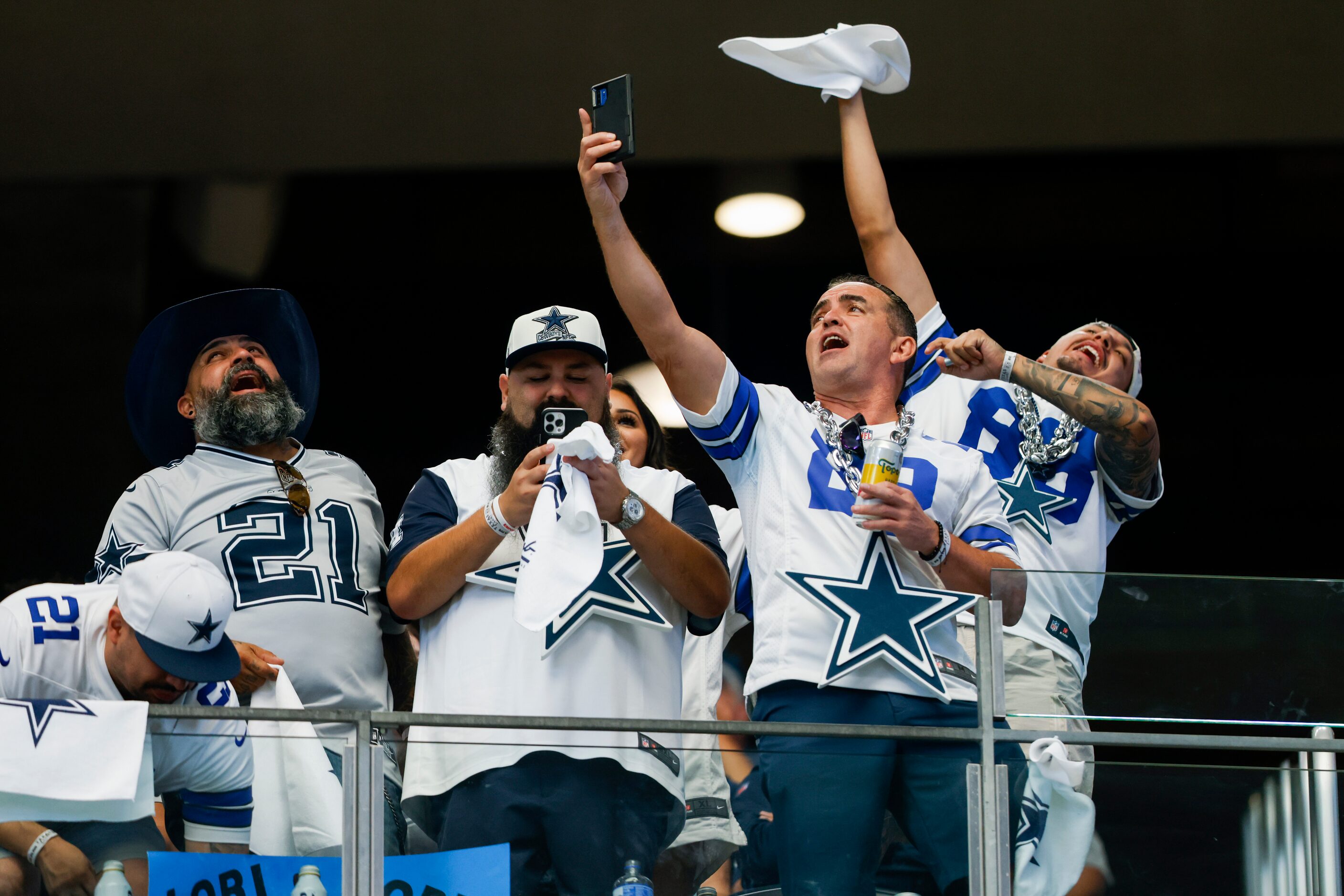 Dallas Cowboys fans sing along to ‘El Rey’ by Vicente Fernandez during the second half of...