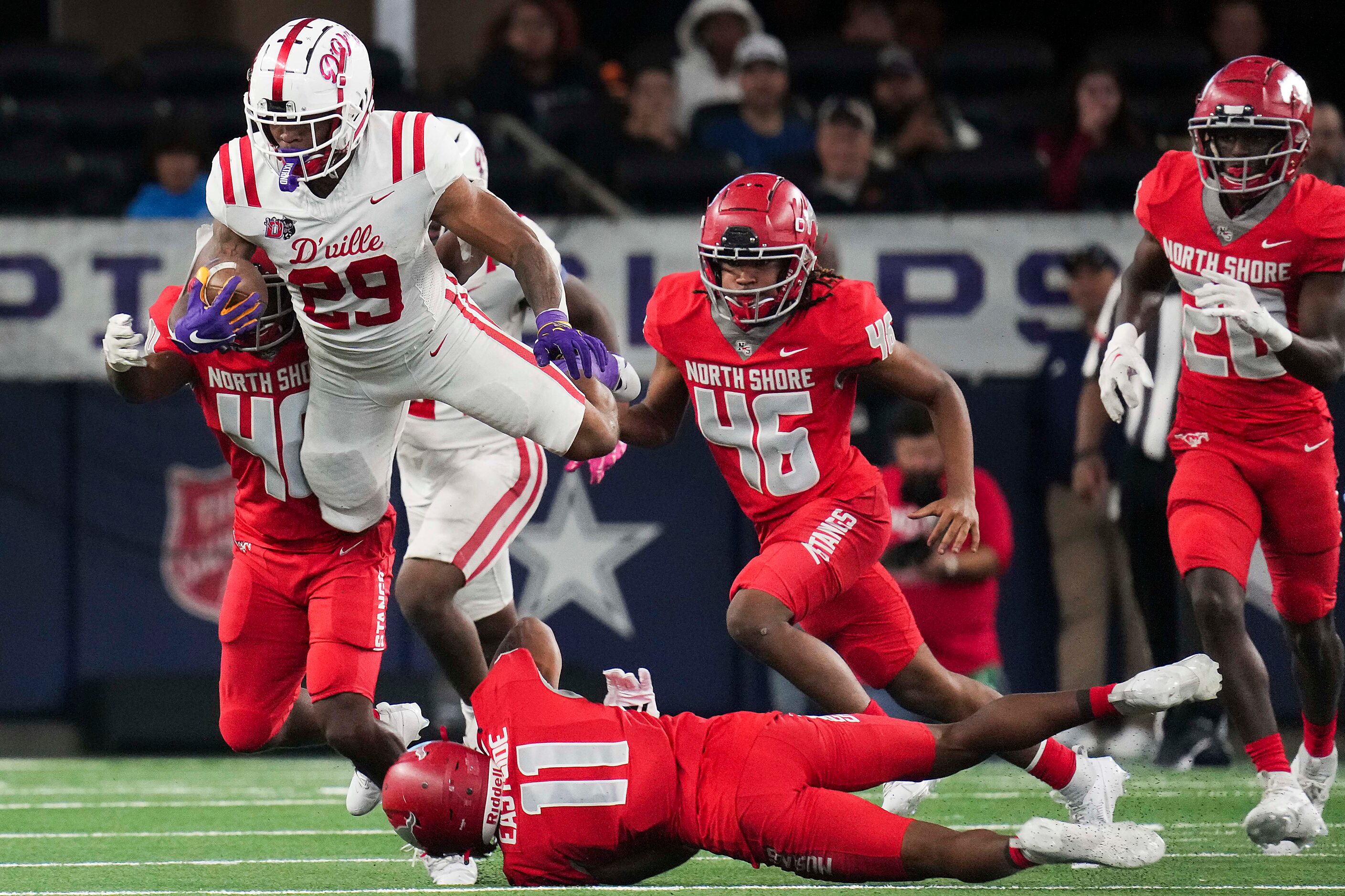 Duncanville running back Caden Durham (29) tries to hurdle Galena Park North Shore’s Jaylen...