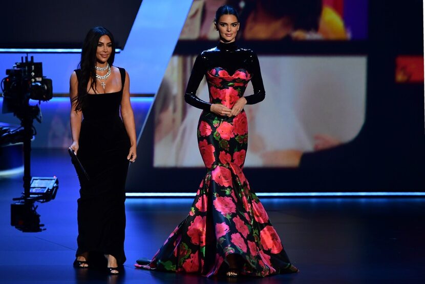 US television personalities Kim Kardashian, left, and Kendall Jenner arrive to present the...