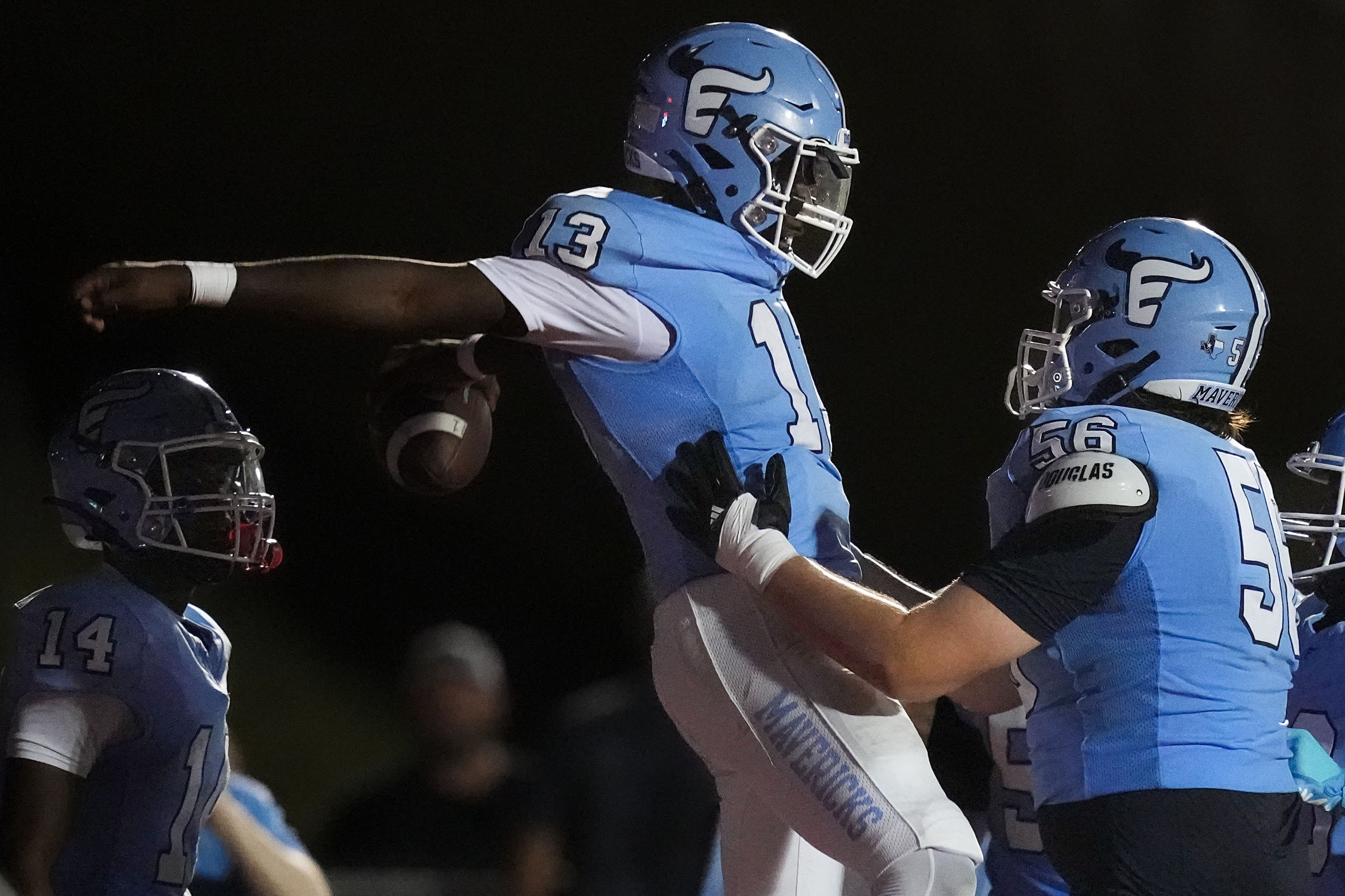 Frisco Emerson quarterback DJ Shelton (13) celebrates with offensive lineman Carson Lilly...