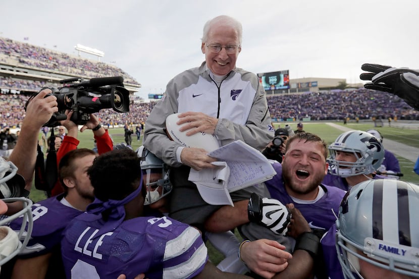 Kansas State head coach Bill Snyder is carried off the field after getting his 200th career...